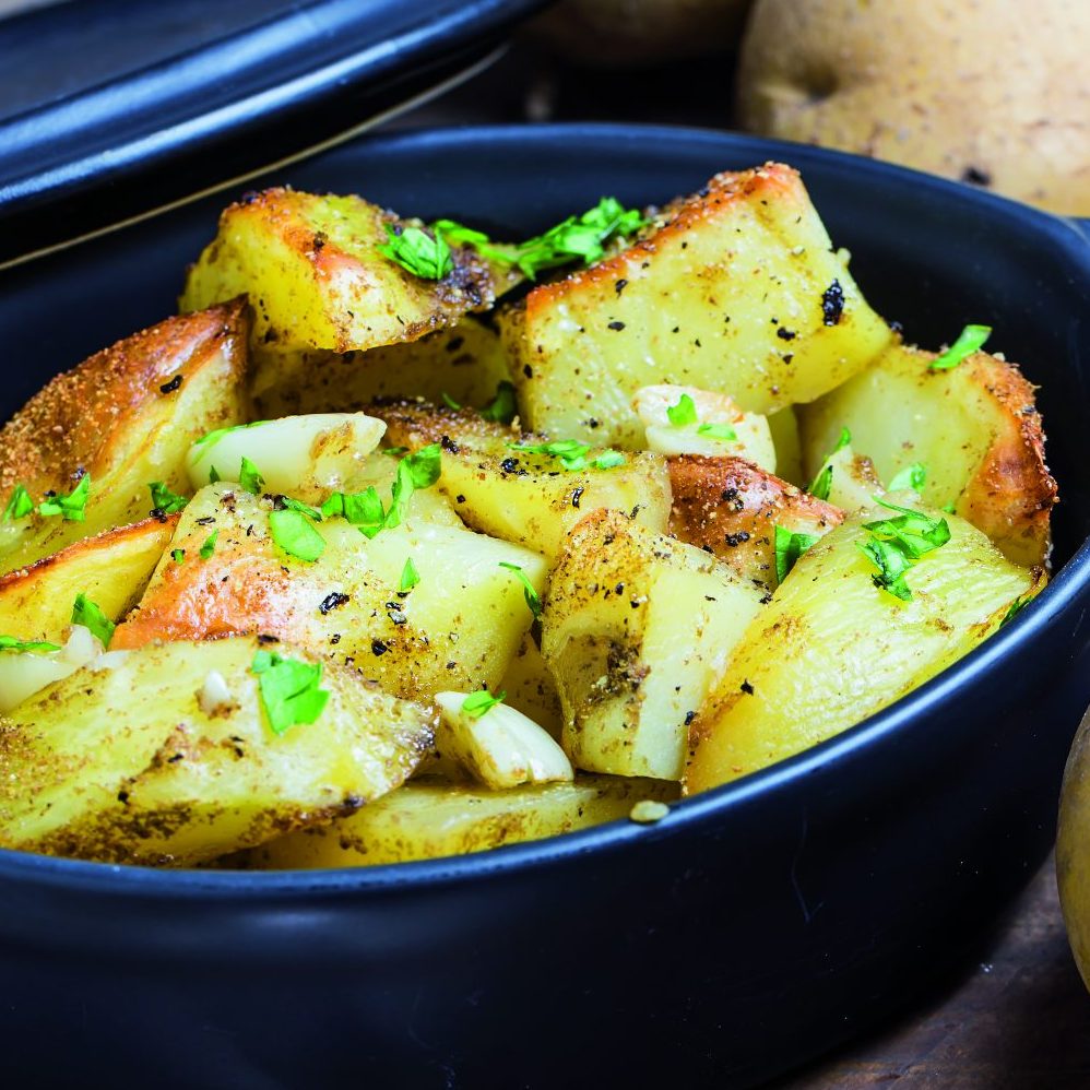 Baked potato, roasted potatoes with rosemary. Selective focus