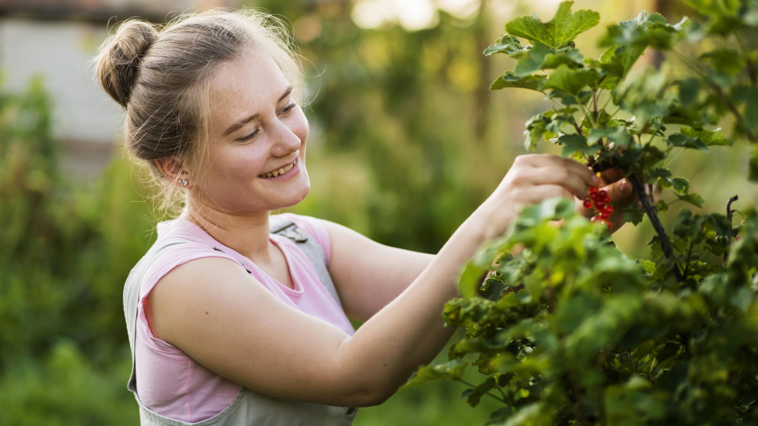 smiley-girl-picking-red-berries